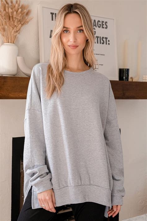 oversized grey crew neck sweatshirt.